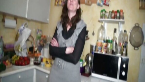 A girl is getting penetrated by a dude on the sofa in front of his wife