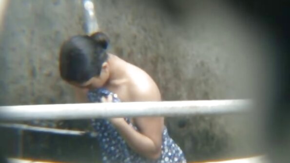 A busty thing is in a sauna and she is getting licked and kissed